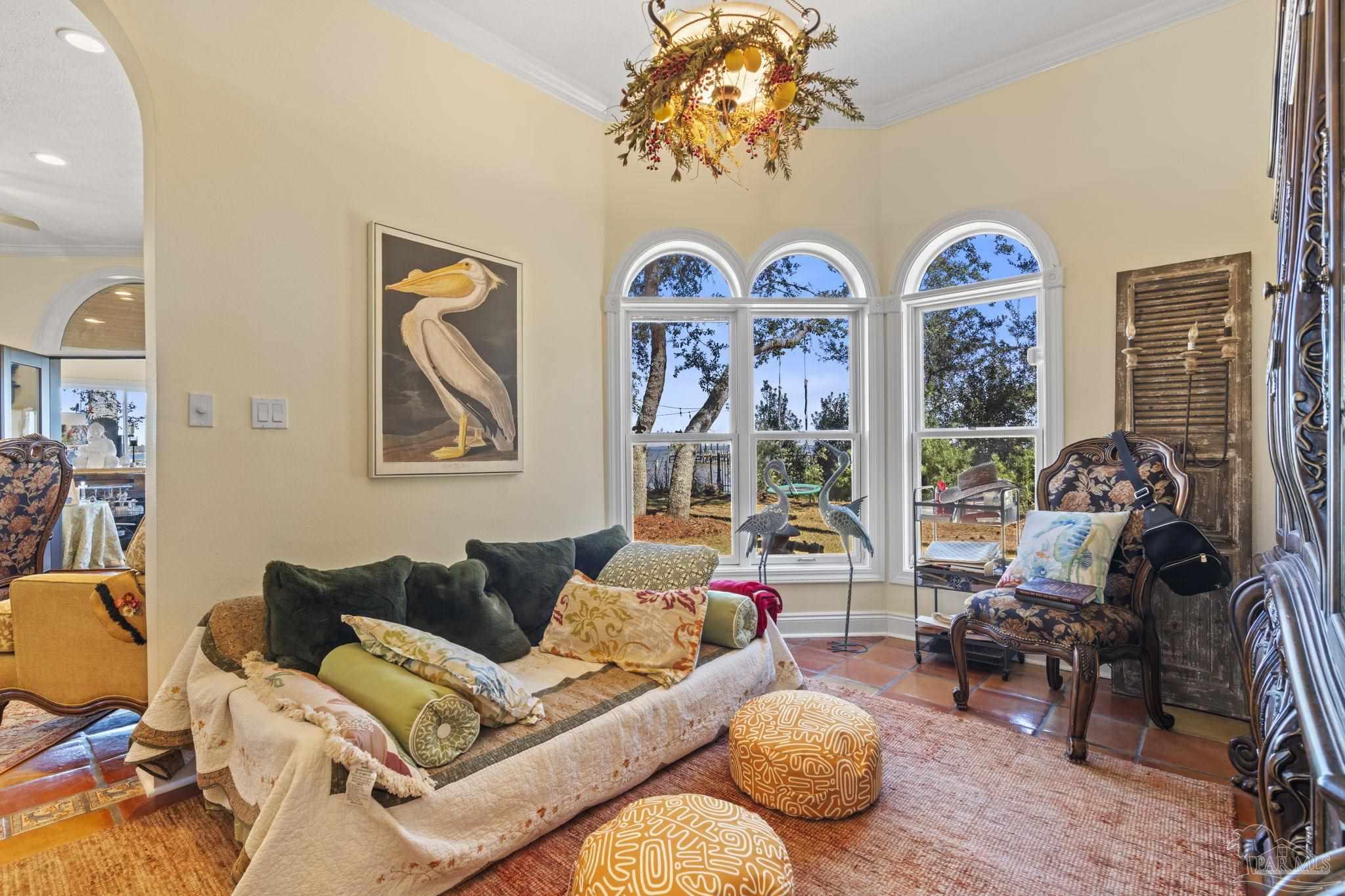 5460 North Shore Road Pensacola, FL 32507 - Photo 15 of 49 a living room with patio furniture and a wooden floor