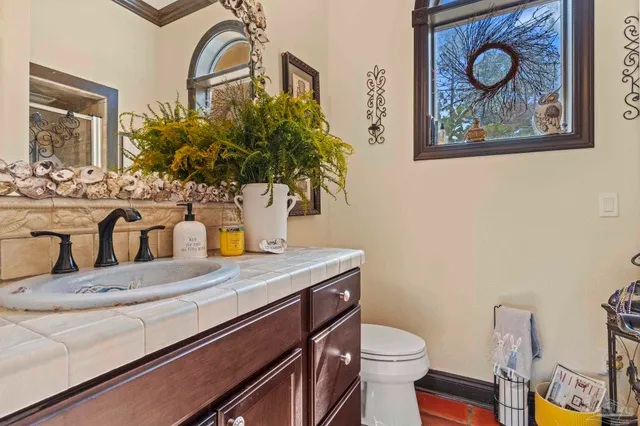 a bath room with a toilet and a sink
