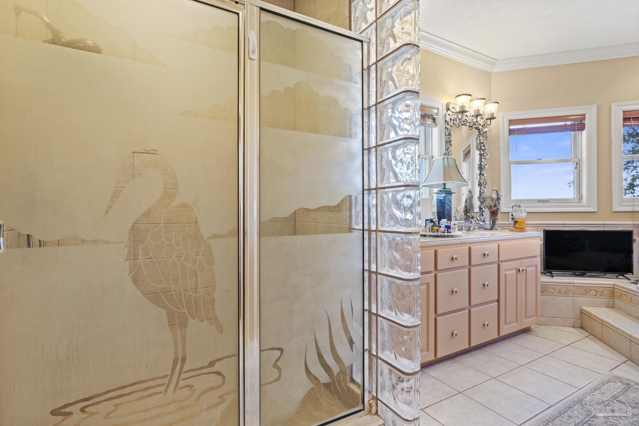 5460 North Shore Road Pensacola, FL 32507 - Photo 22 of 49 a bathroom with a double vanity sink mirror and shower