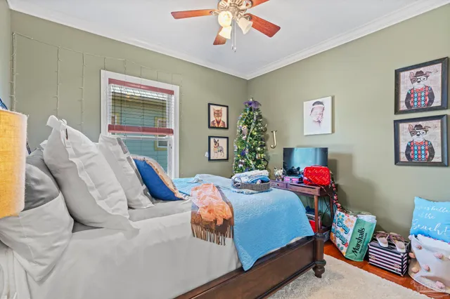 a bedroom with bed and a window