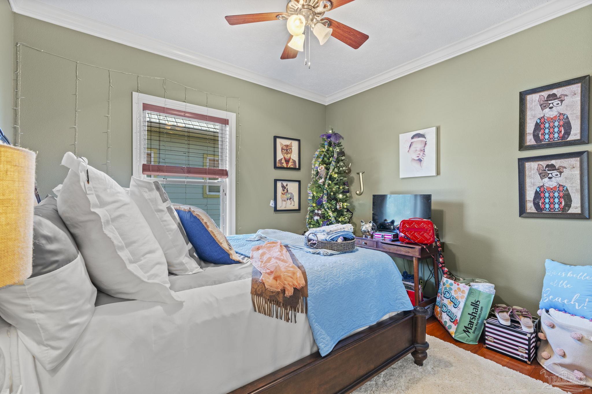5460 North Shore Road Pensacola, FL 32507 - Photo 24 of 49 a bedroom with bed and a window