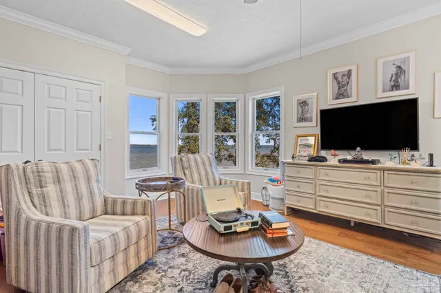 a living room with furniture and a flat screen tv