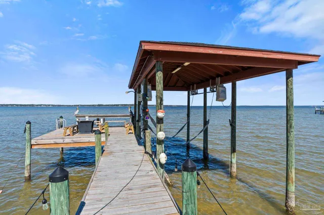 a balcony view with couple of chairs