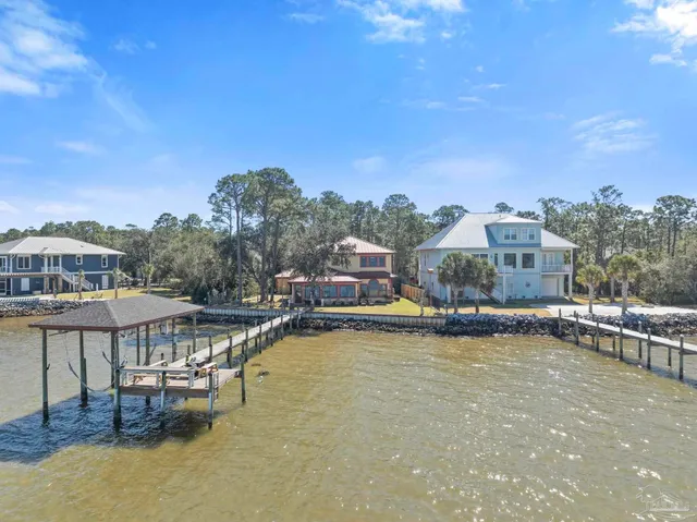 a view of a swimming pool with a table and chairs