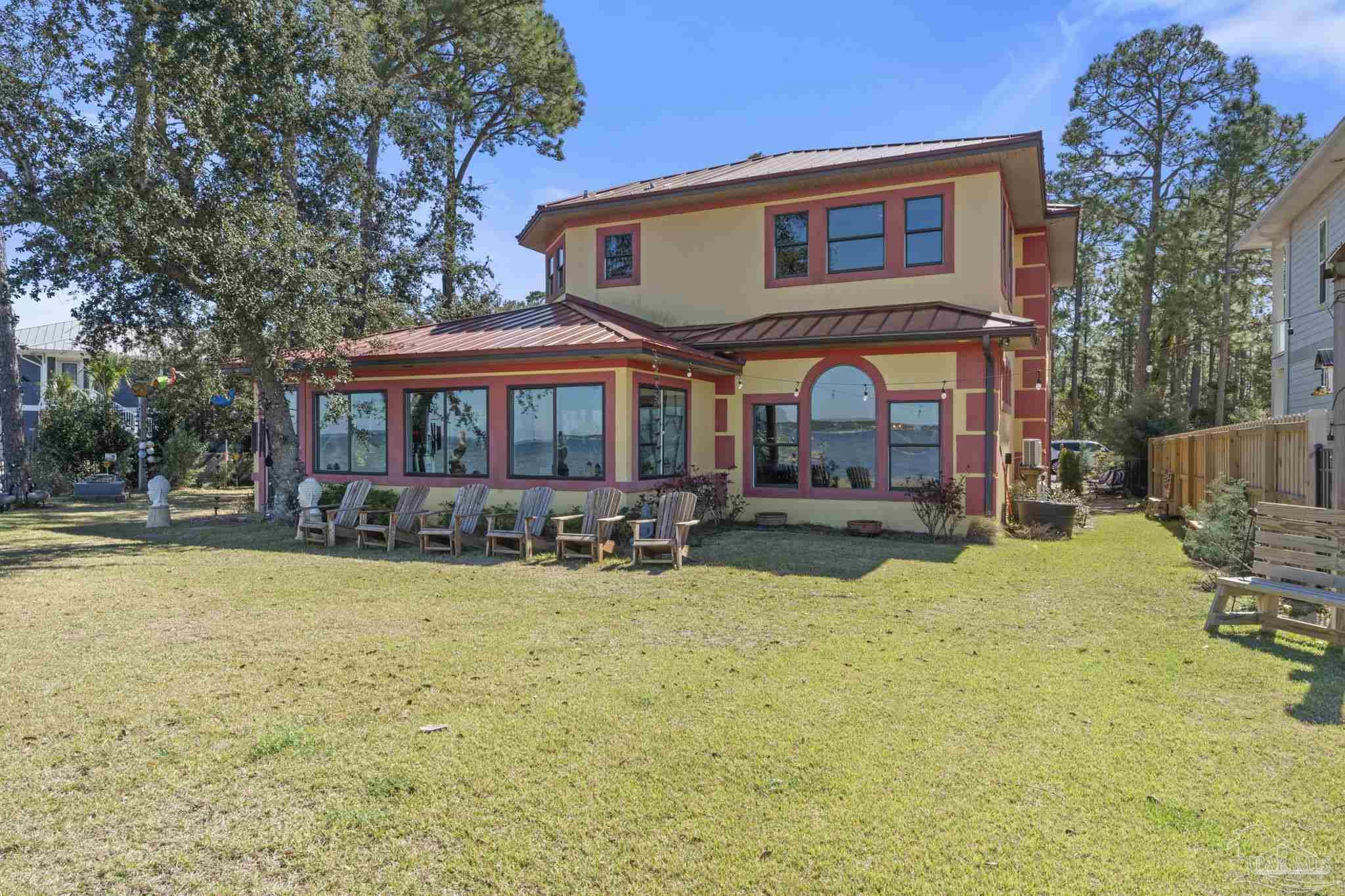 5460 North Shore Road Pensacola, FL 32507 - Photo 36 of 49 a view of a house with swimming pool and sitting area