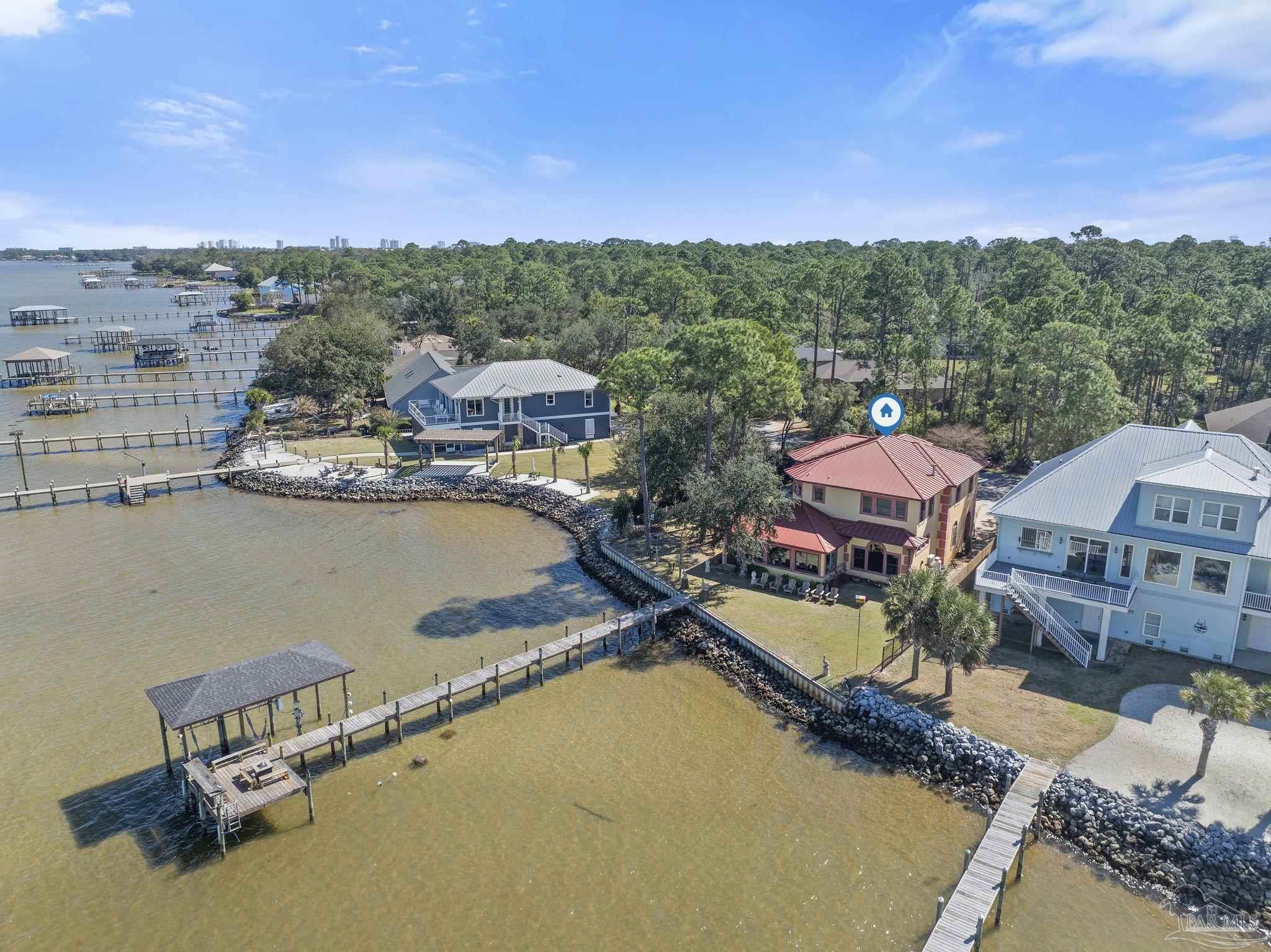 5460 North Shore Road Pensacola, FL 32507 - Photo 42 of 49 a view of a lake with a city