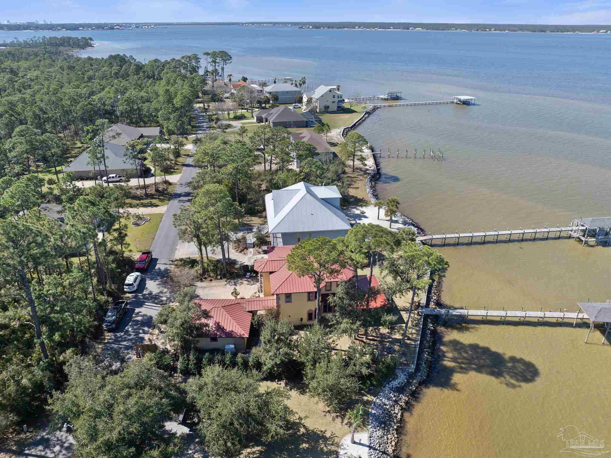 5460 North Shore Road Pensacola, FL 32507 - Photo 43 of 49 an aerial view of a houses with a lake view