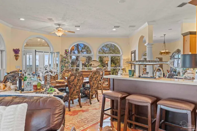 a view of a livingroom with furniture window and wooden floor