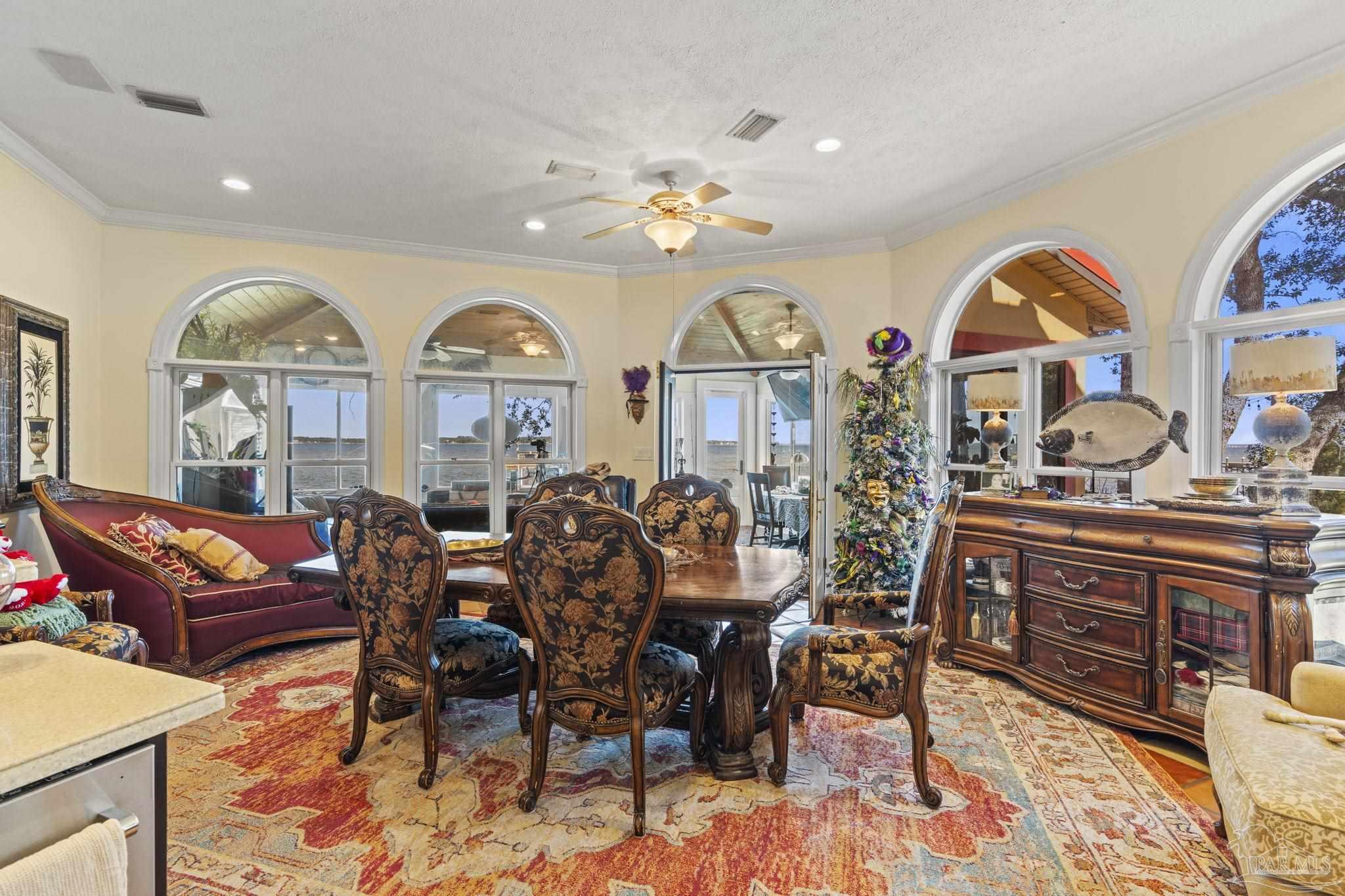 5460 North Shore Road Pensacola, FL 32507 - Photo 7 of 49 a view of a livingroom with furniture and a chandelier