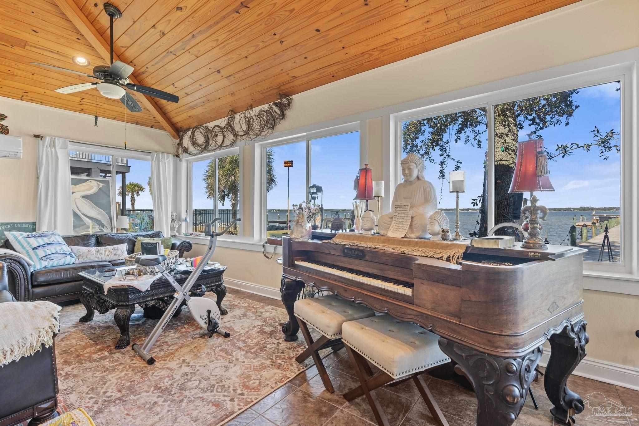 5460 North Shore Road Pensacola, FL 32507 - Photo 8 of 49 a living room with furniture and a large window