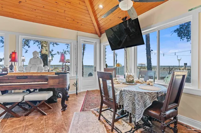 a view of a dining room with furniture window and outdoor kitchen