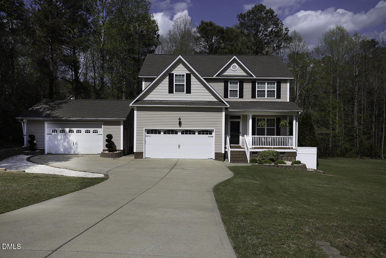 97 Bounty Circle Angier, NC 27501 - Photo 1 of 43 a front view of a house with a garden