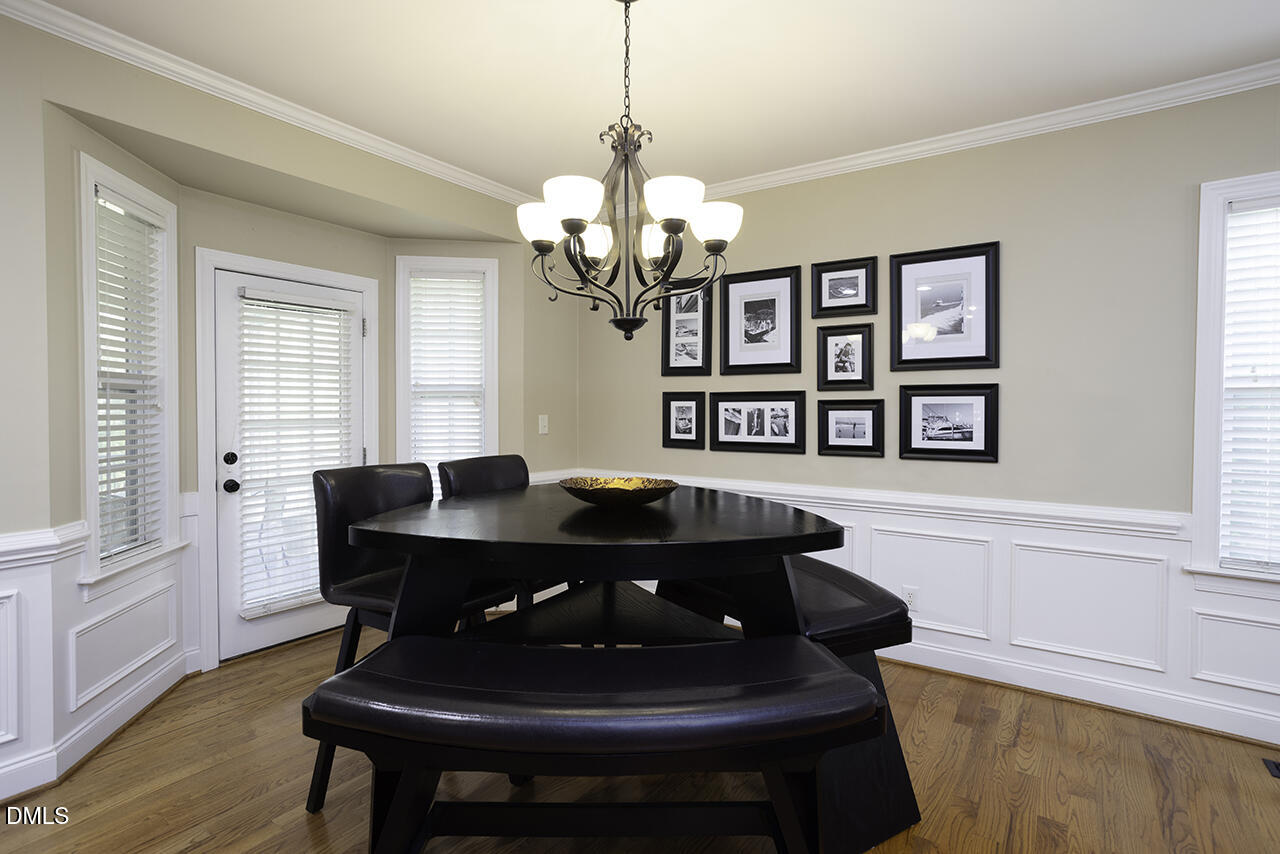 97 Bounty Circle Angier, NC 27501 - Photo 12 of 43 a living room with furniture and a chandelier