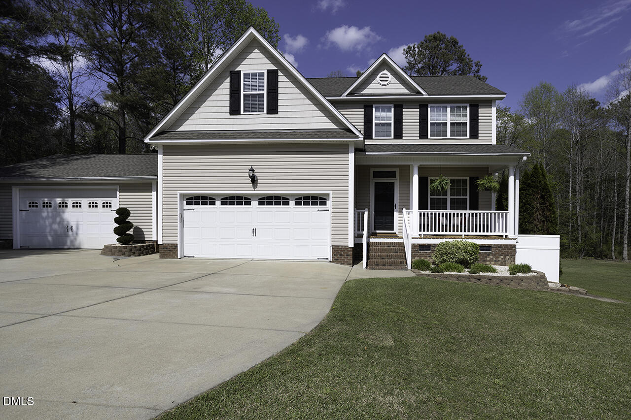 97 Bounty Circle Angier, NC 27501 - Photo 2 of 43 a front view of a house with a yard