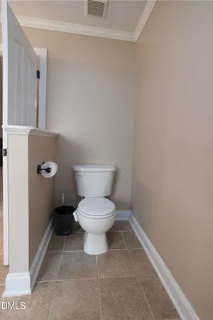 a white toilet sitting next to a white sink