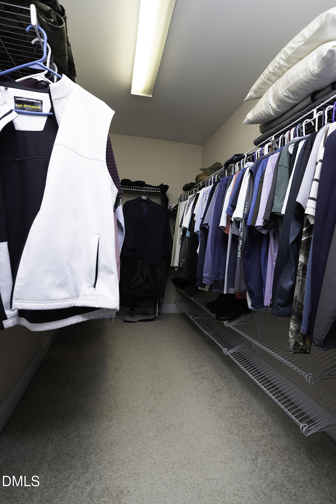 97 Bounty Circle Angier, NC 27501 - Photo 24 of 43 a view of walk in closet with clothes and shoes
