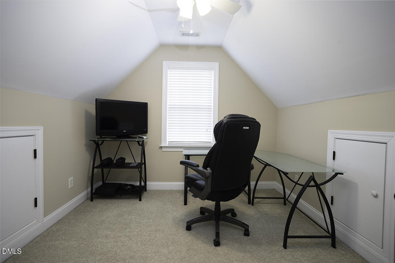 97 Bounty Circle Angier, NC 27501 - Photo 25 of 43 a view of a workspace with furniture and a window