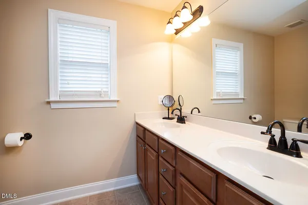 a bathroom with a sink and a window