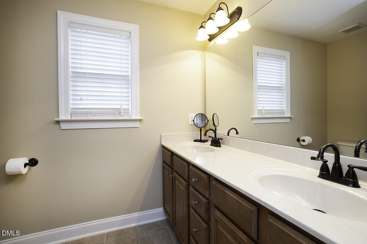 97 Bounty Circle Angier, NC 27501 - Photo 28 of 43 a bathroom with a sink and a window