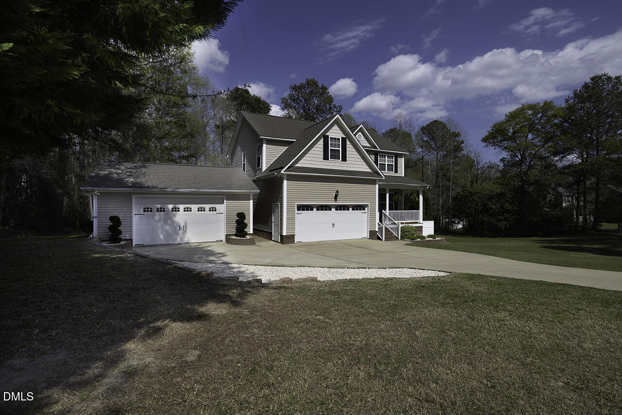 97 Bounty Circle Angier, NC 27501 - Photo 3 of 43 a front view of a house with a yard