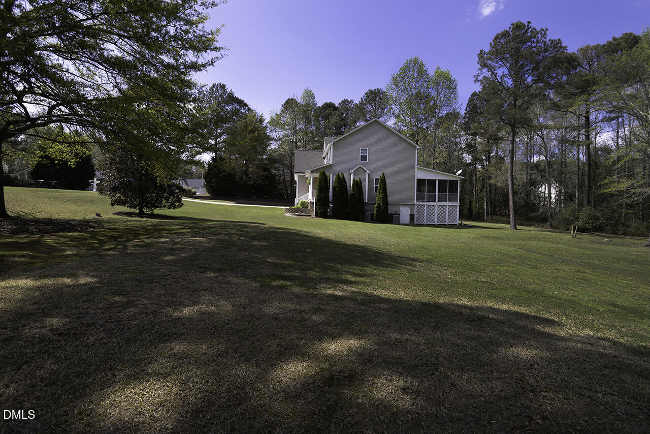 97 Bounty Circle Angier, NC 27501 - Photo 36 of 43 a front view of a house with a yard