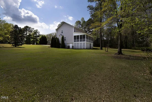 a view of a big yard with a house