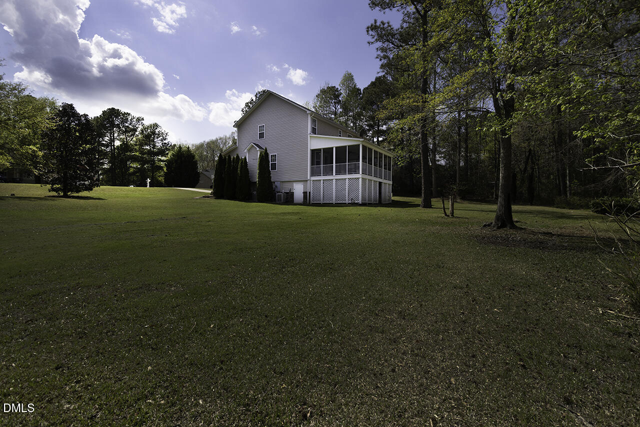 97 Bounty Circle Angier, NC 27501 - Photo 37 of 43 a view of a big yard with a house