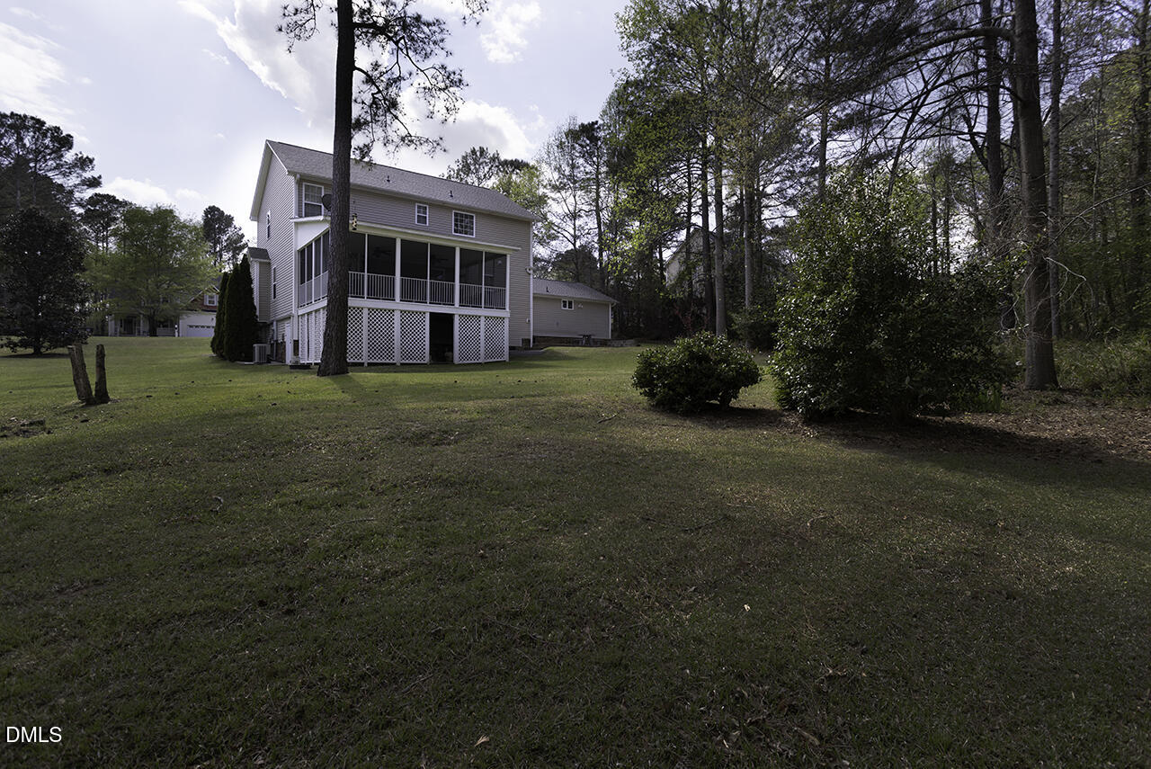 97 Bounty Circle Angier, NC 27501 - Photo 38 of 43 a view of house with yard and entertaining space