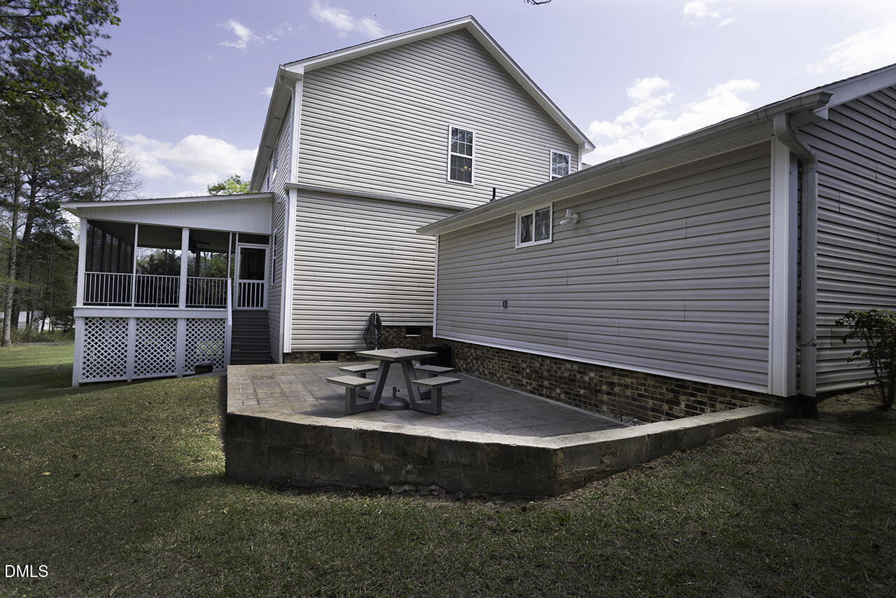 97 Bounty Circle Angier, NC 27501 - Photo 40 of 43 a view of a house with backyard and sitting area