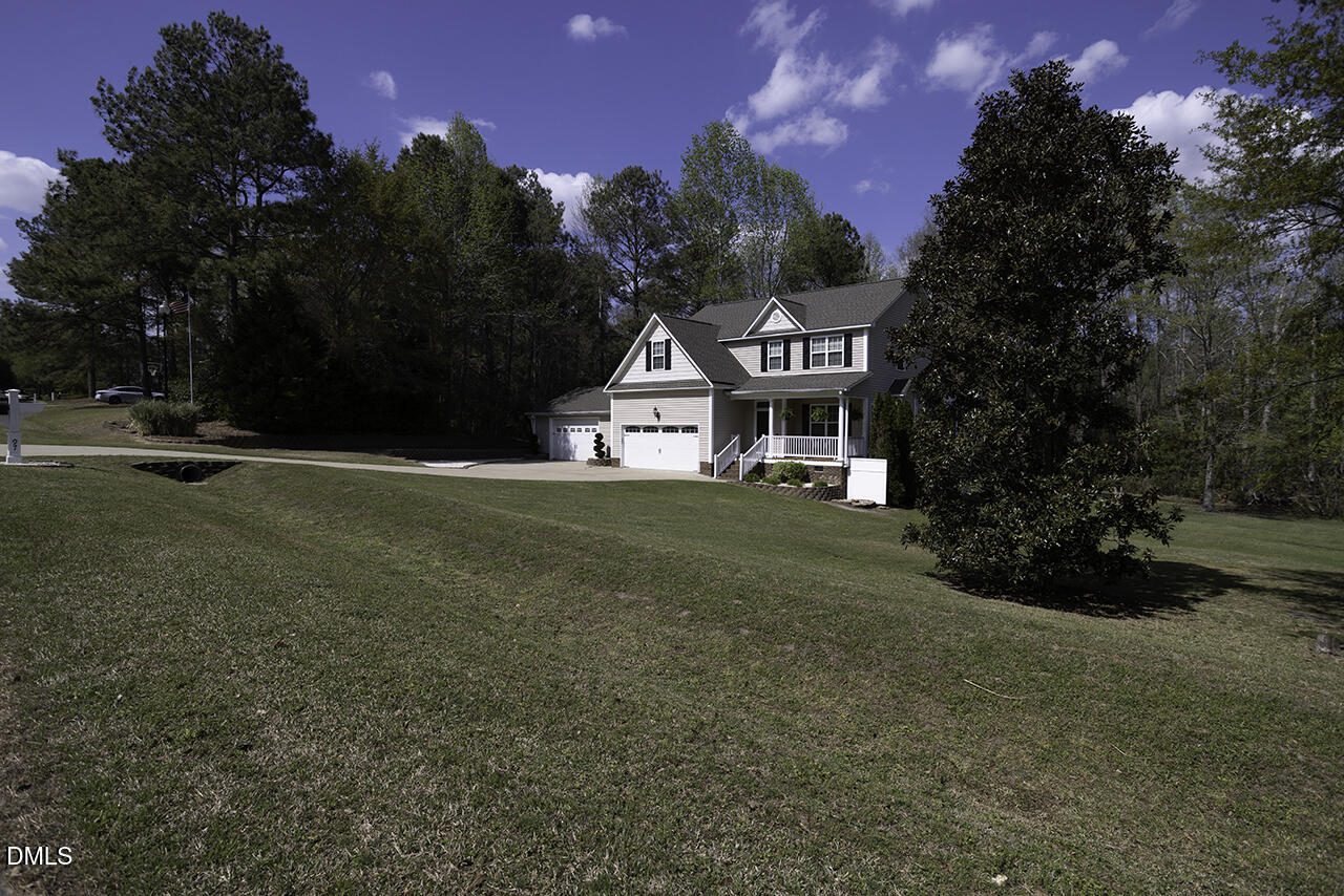 97 Bounty Circle Angier, NC 27501 - Photo 4 of 43 a front view of a house with a yard