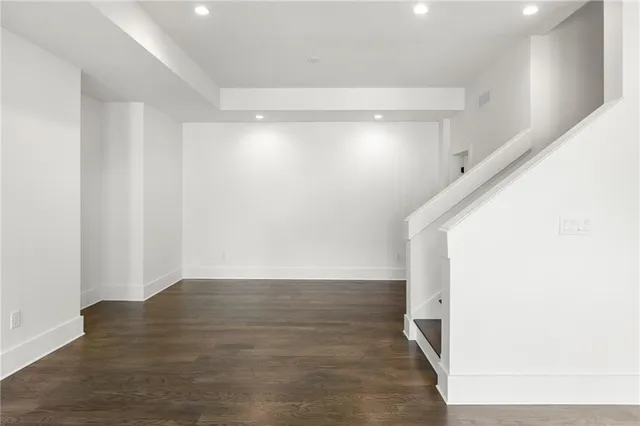 a view of hallway with wooden floor