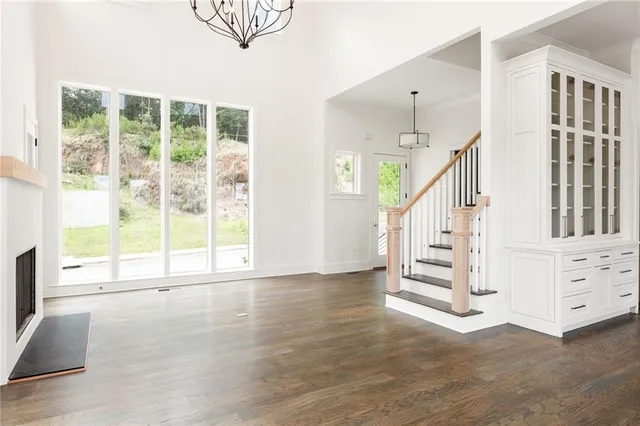 a view of an entryway with wooden floor and windows