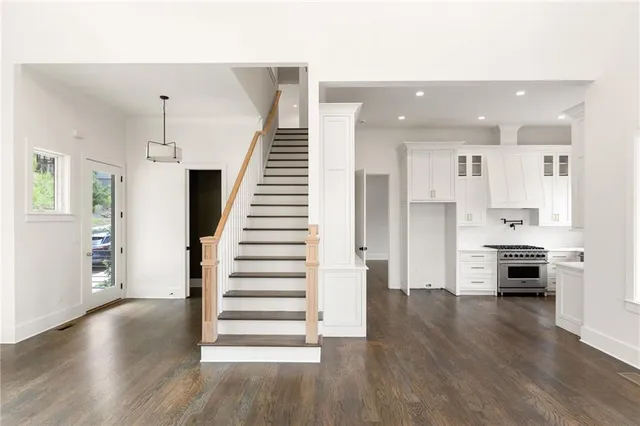 a view of kitchen with sink and wooden floor