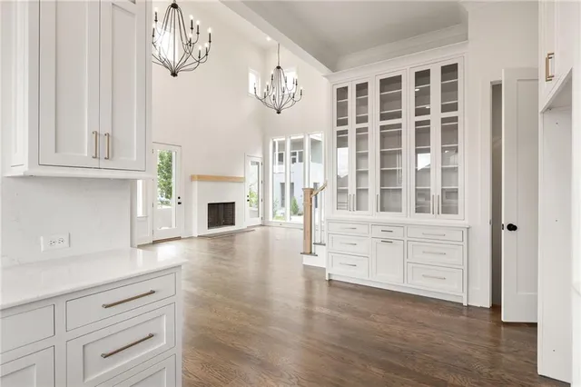 wooden floor white cabinets and window