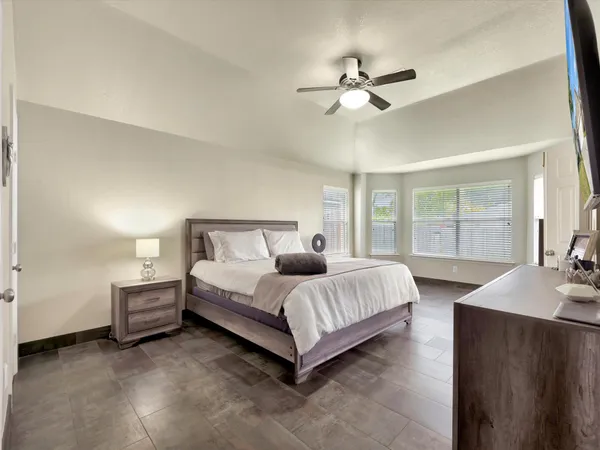 a bedroom with bed and window