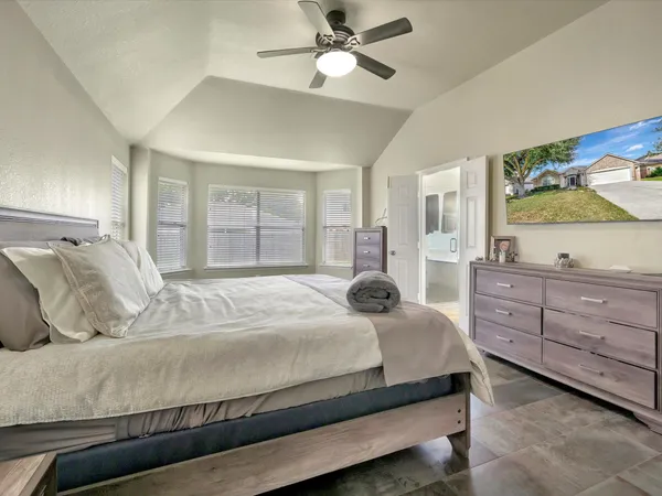 a bedroom with a bed and a dresser