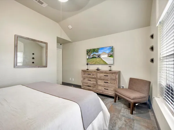 a bedroom with a bed and furniture