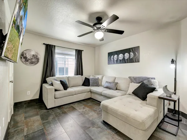 a living room with furniture and a window