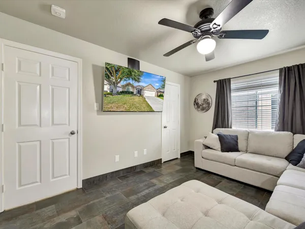 a living room with furniture and a large window