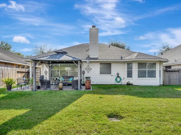 a front view of a house with a garden and porch