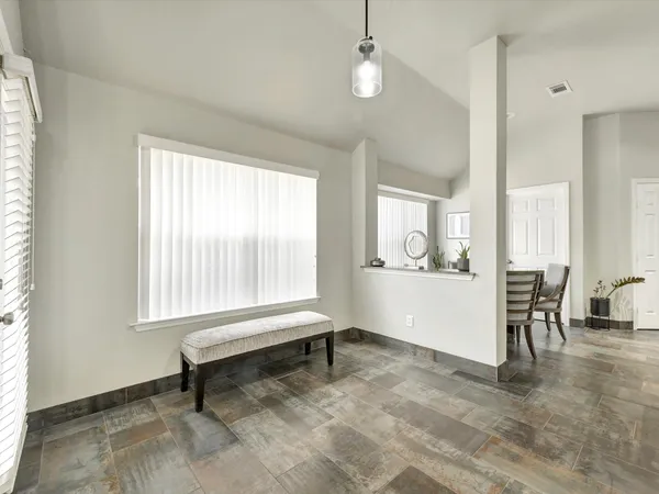 a living room with furniture and a window
