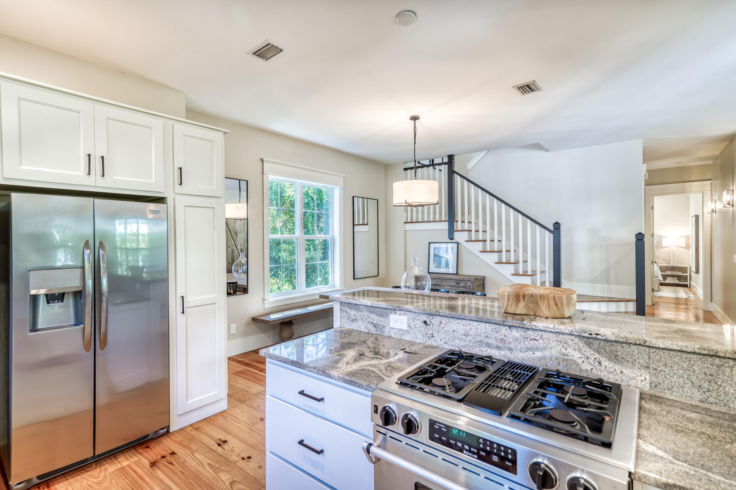 47 Hammock Lane Santa Rosa Beach, FL 32459 - Photo 17 of 51 a kitchen with stainless steel appliances granite countertop a stove a refrigerator and a granite counter tops with wooden floors
