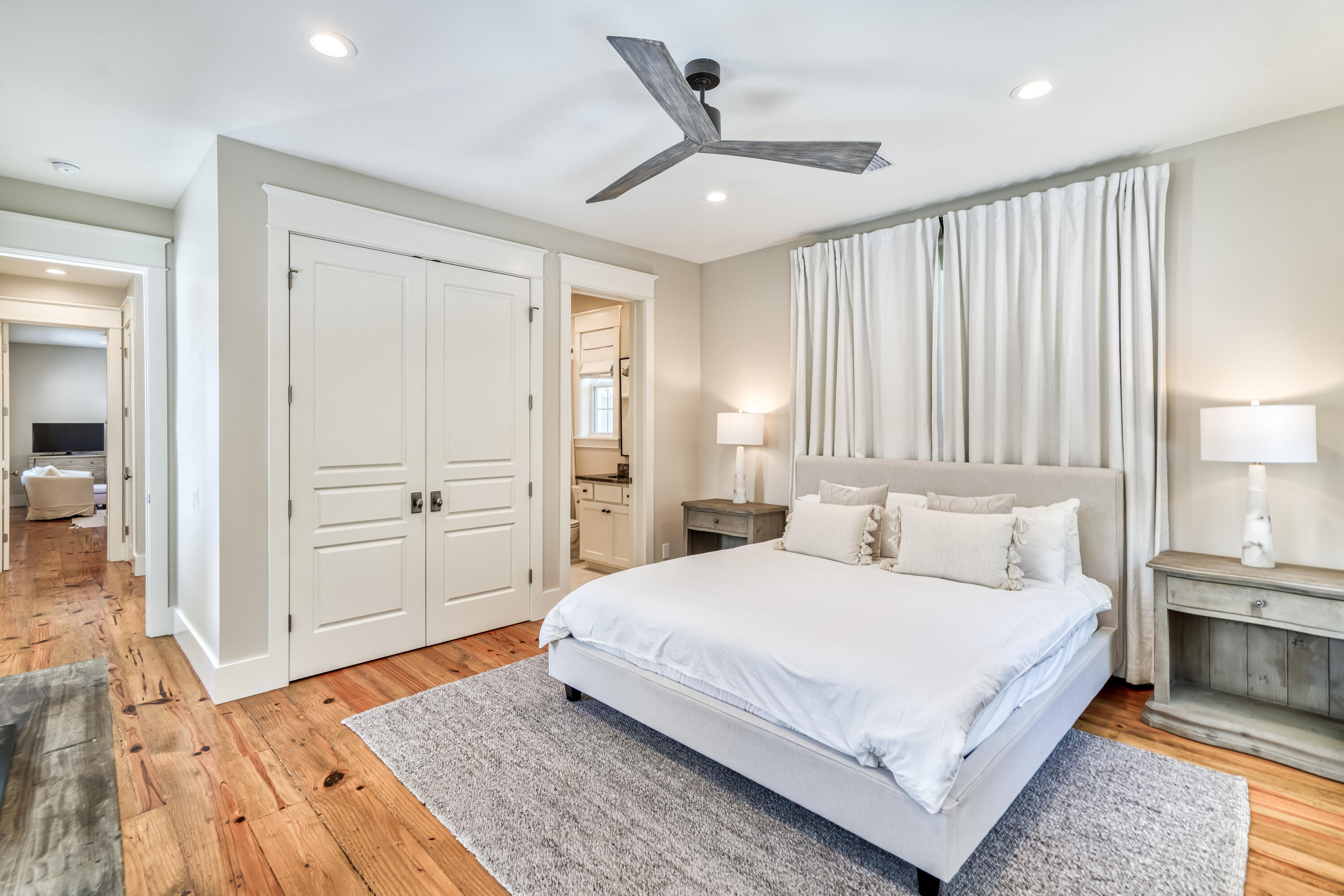 47 Hammock Lane Santa Rosa Beach, FL 32459 - Photo 37 of 51 a bedroom with a large bed and a chandelier