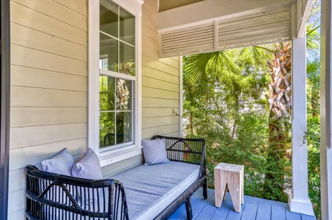 a wooden bench sitting in front of a building