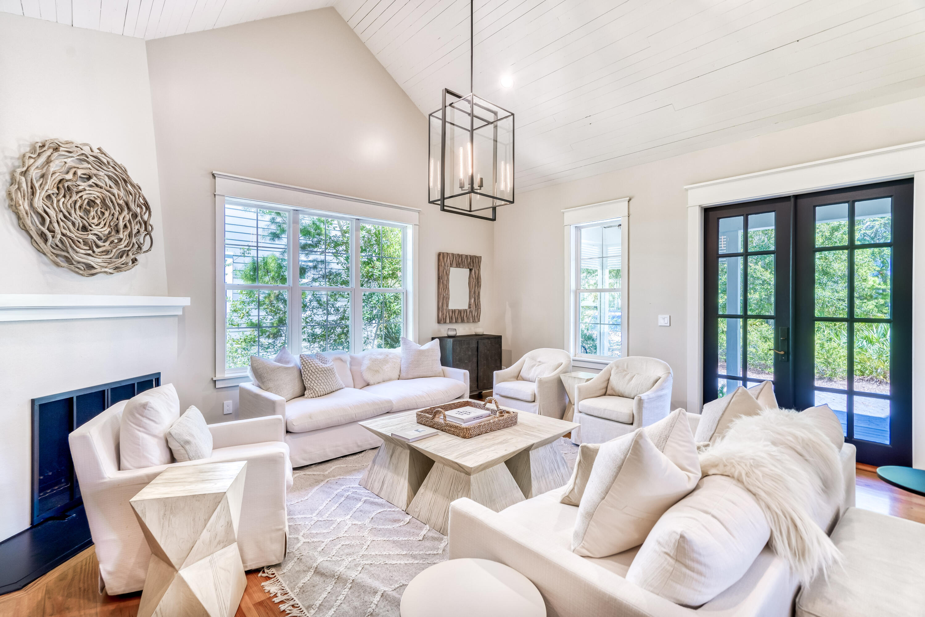 47 Hammock Lane Santa Rosa Beach, FL 32459 - Photo 7 of 51 a living room with furniture fireplace and a large window
