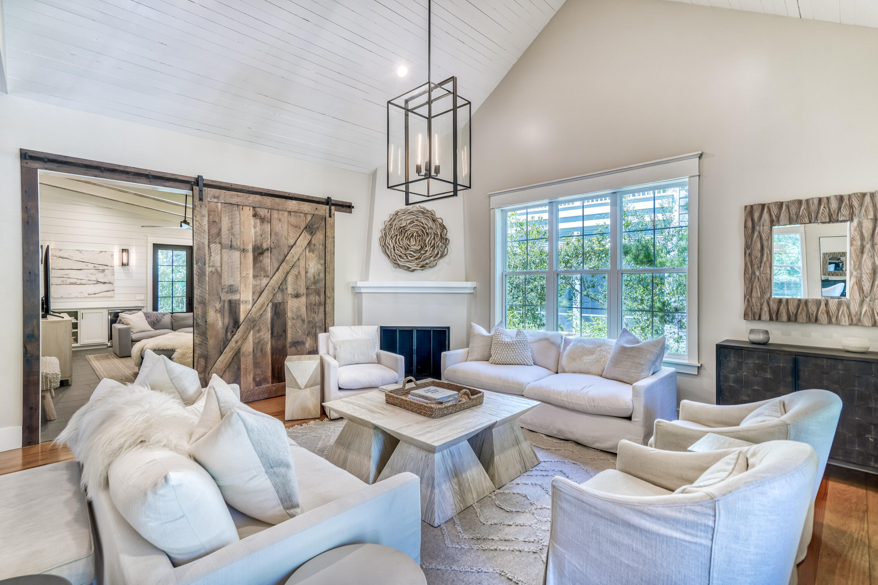 47 Hammock Lane Santa Rosa Beach, FL 32459 - Photo 8 of 51 a living room with furniture a fireplace and a large window