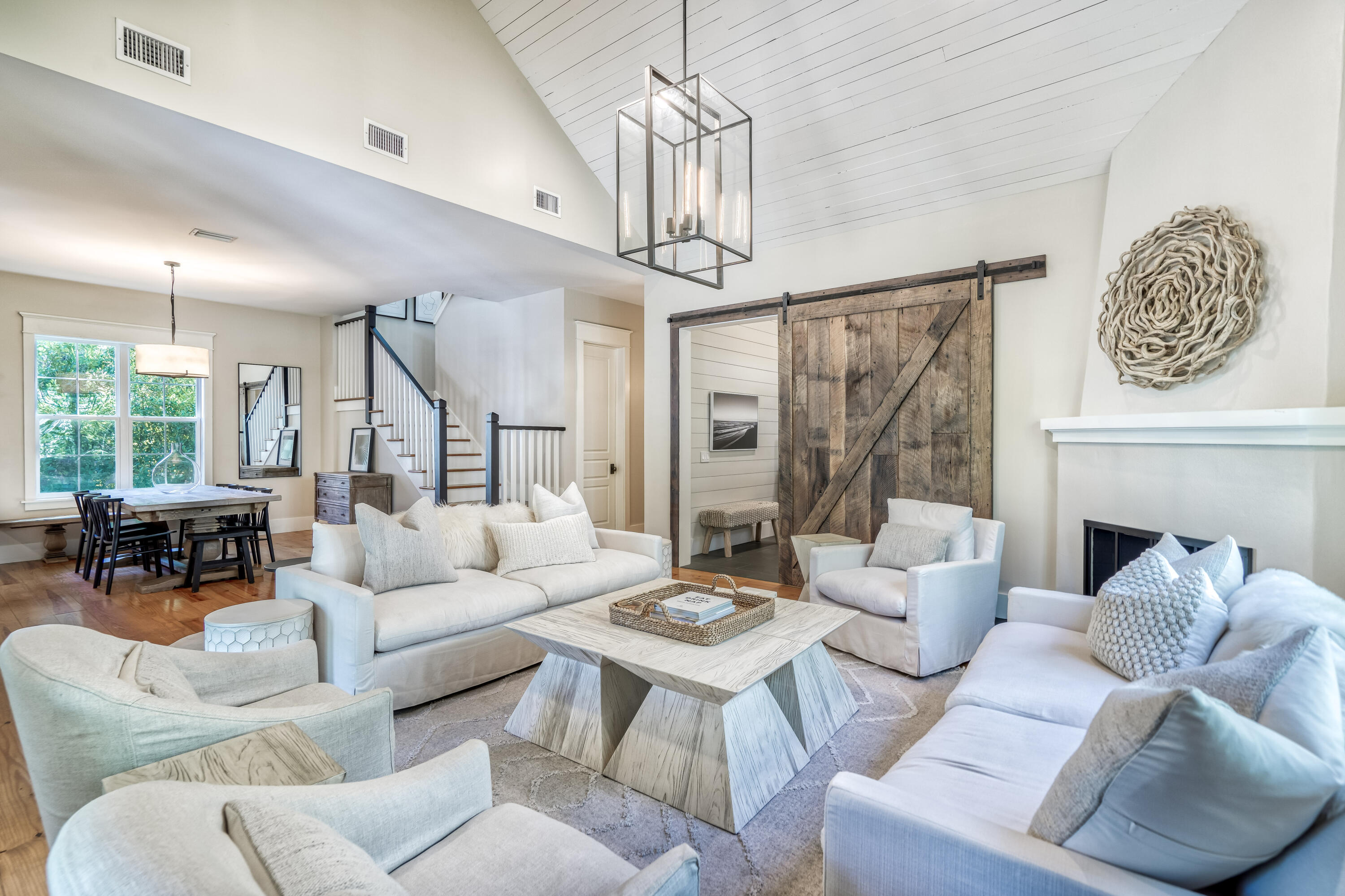 47 Hammock Lane Santa Rosa Beach, FL 32459 - Photo 9 of 51 a living room with furniture a fireplace and a chandelier