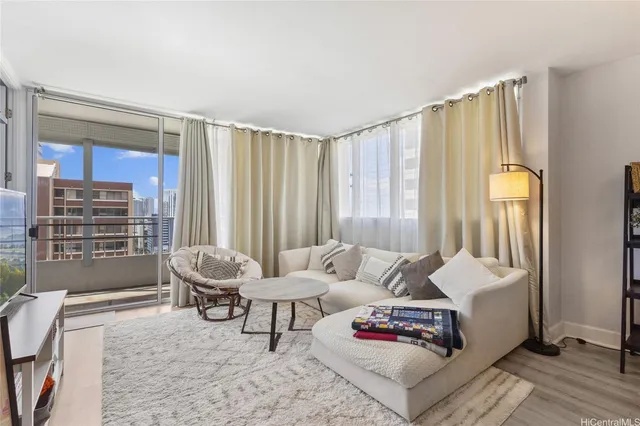 a living room with furniture and a large window