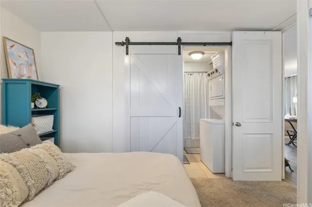 a bedroom with a bed and a shower