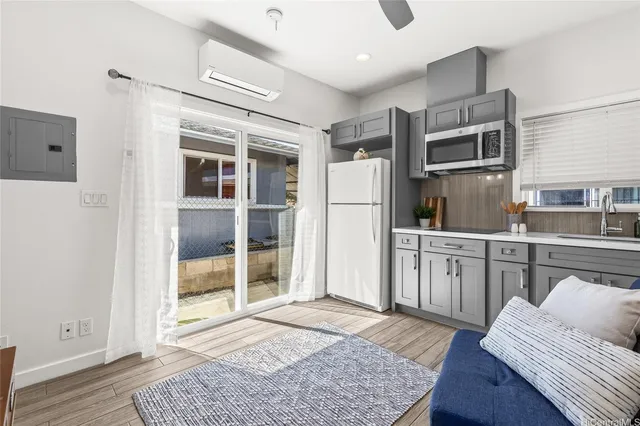 a kitchen with stainless steel appliances granite countertop a refrigerator and stove